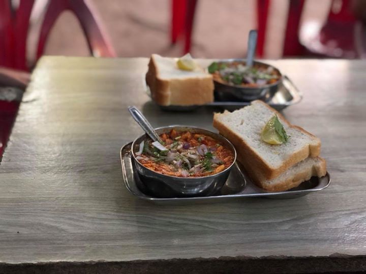 Finally Kolhapuri misal.
Misal Pav is relished as a breakfast as well as a snack through out Maharashtra.
A combination of sprouts + coconut and onion gravy(rasa) + mixture = misal 
Spicy usal is topped with a spicy thin gravy ( Kat / tarri / rassa ) and is served with a soft fresh bread. mixture of farsan ,onion ,tomato and coriander leaves enhances the taste. A squeeze from the lime adds the extra tang.
#kolhapurimisal #misalpav #mahrashtrian #streetfood #kolhapurifood #streetfood