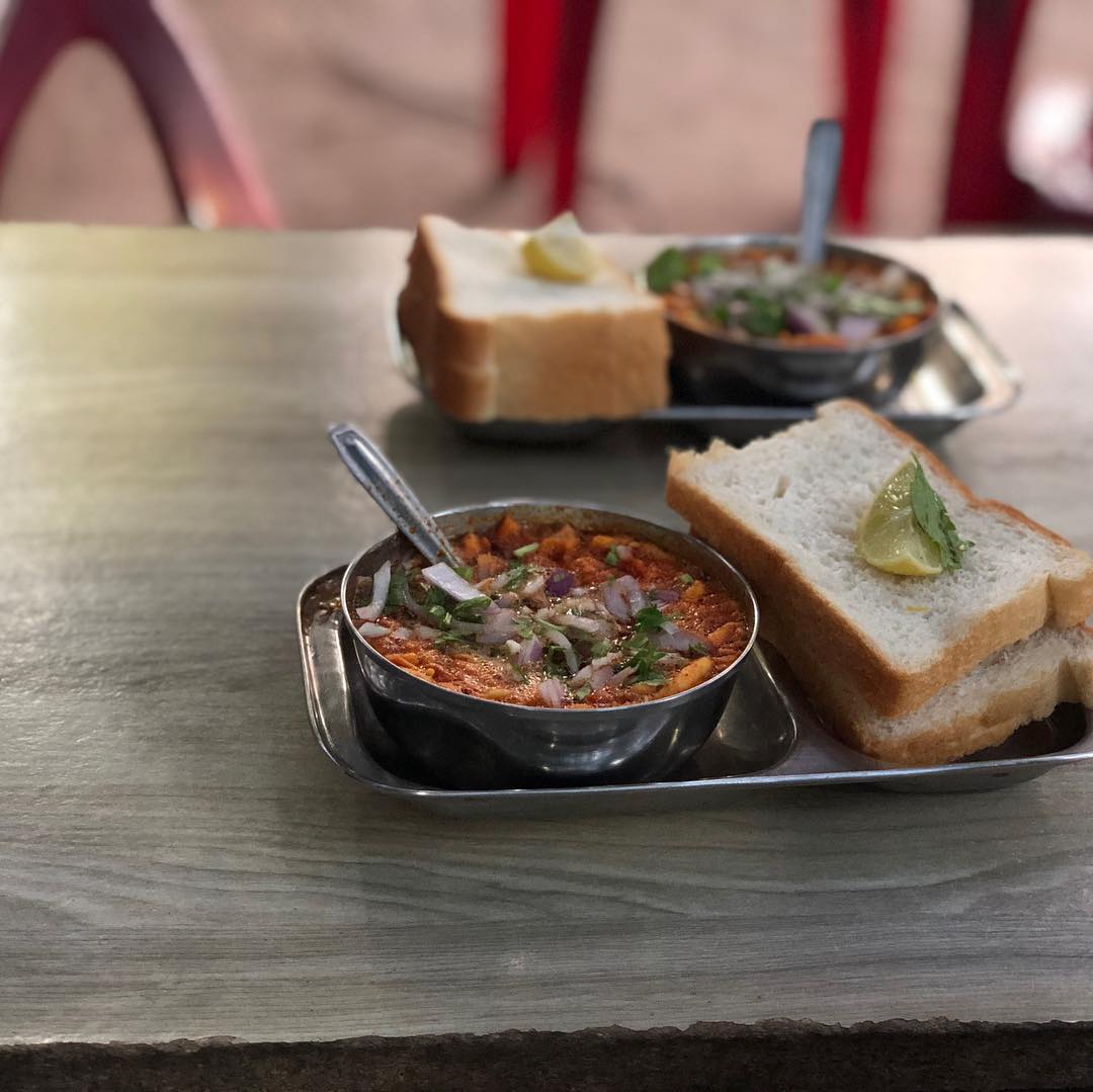 Finally Kolhapuri misal.
Misal Pav is relished as a breakfast as well as a snack through out Maharashtra.
A combination of sprouts + coconut and onion gravy(rasa) + mixture = misal 
Spicy usal is topped with a spicy thin gravy ( Kat / tarri / rassa ) and is served with a soft fresh bread. mixture of farsan ,onion ,tomato and coriander leaves enhances the taste. A squeeze from the lime adds the extra tang.
#kolhapurimisal #misalpav #mahrashtrian #streetfood #kolhapurifood #streetfood #kolhapurdiaries #kolhapuristyle #kolhapuri #kolhapurifoodie