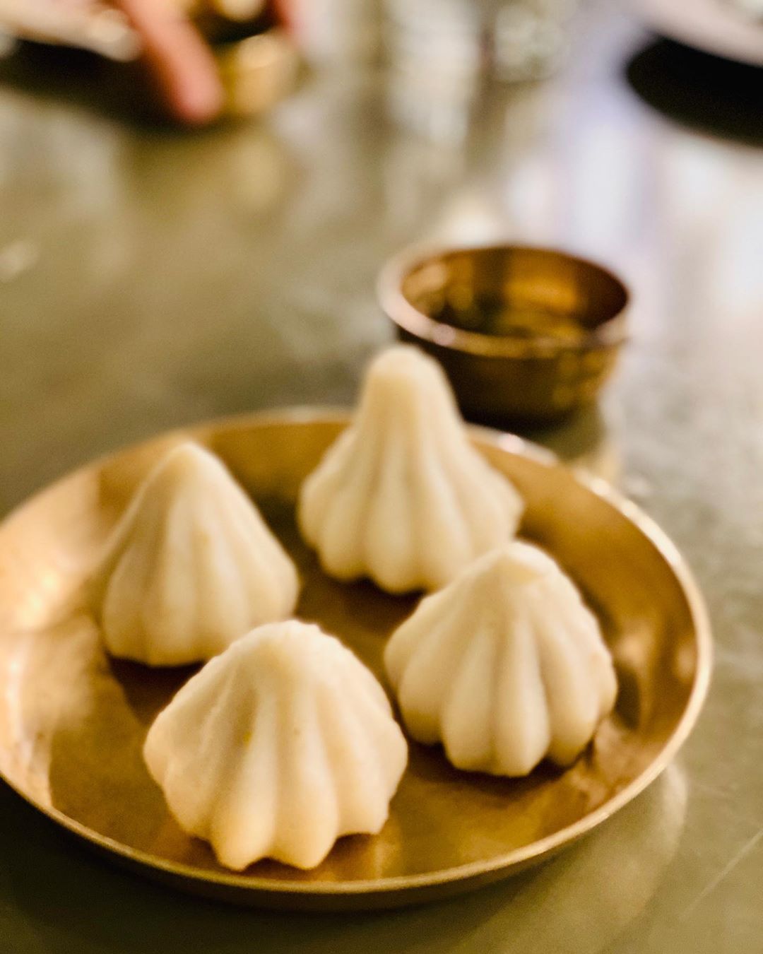 Growing up in Maharashtra, I came to grow fond of its culture and its scrumptious food. 
From Bappa’s favourite food - modak to lipsmacking cilantro fritters aka kothimbir vadi. 
The food reminded me of my home town Kolhapur. 
Meeting people from Maharashtra or eating Marathi food brings out that smile and feeling of joy within.
#maharastra #maharashtafood #marathimulgi #modak #kolhapuri